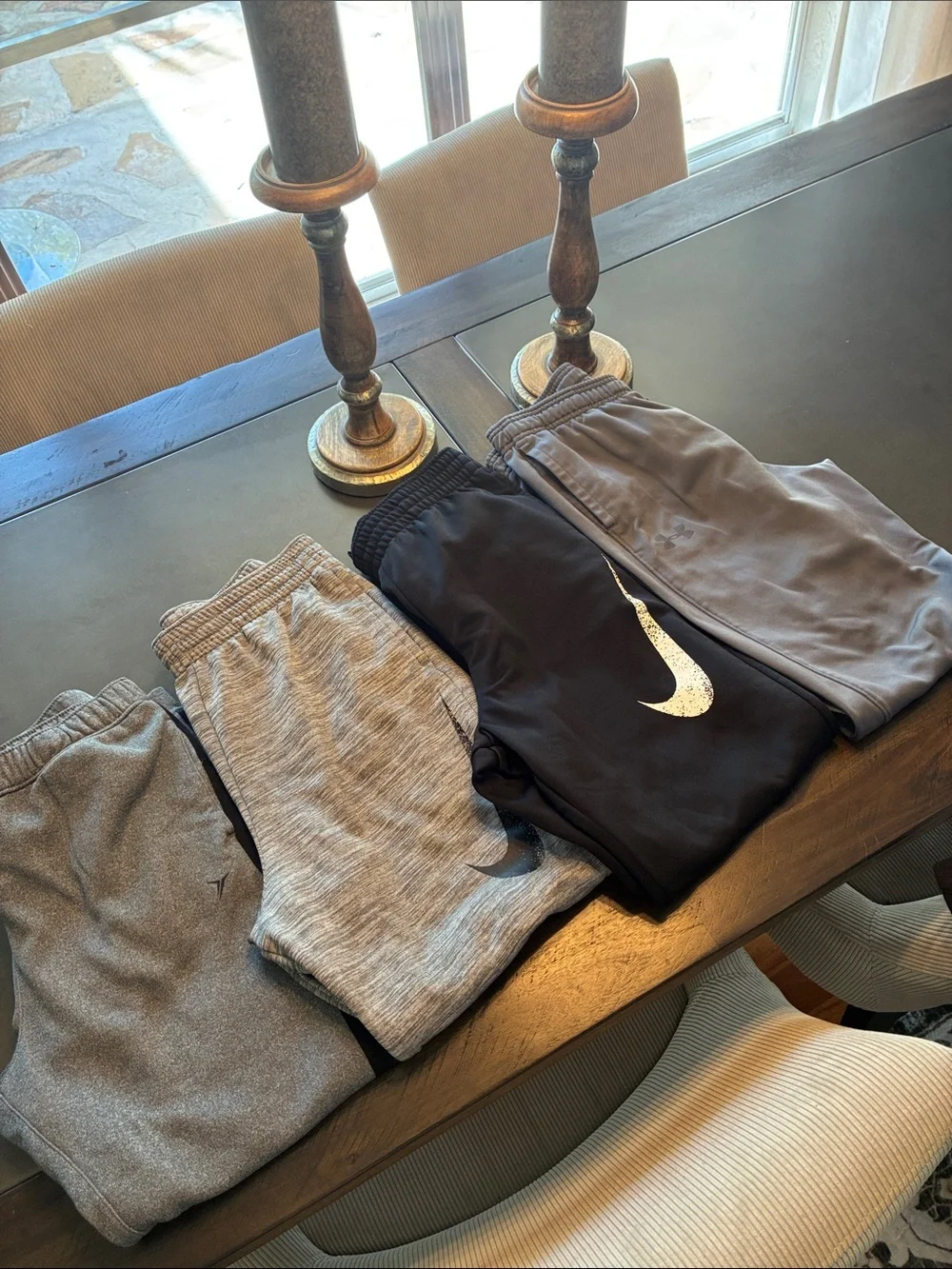 4 pair Nike, Under Armor, Old Navy yxl Black and Gray Joggers